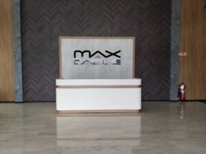 Max Cable acrylic logo mounted on reception backdrop