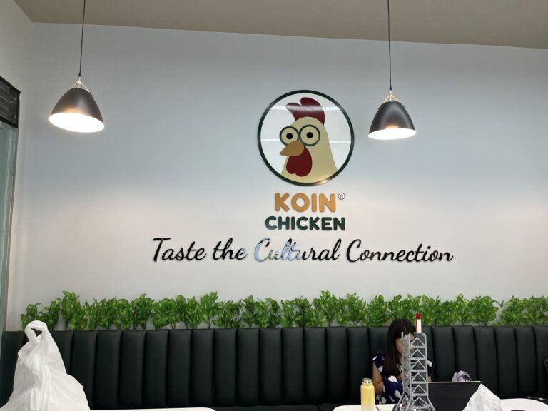 Koin Chicken acrylic logo wall with Taste the Cultural Connection