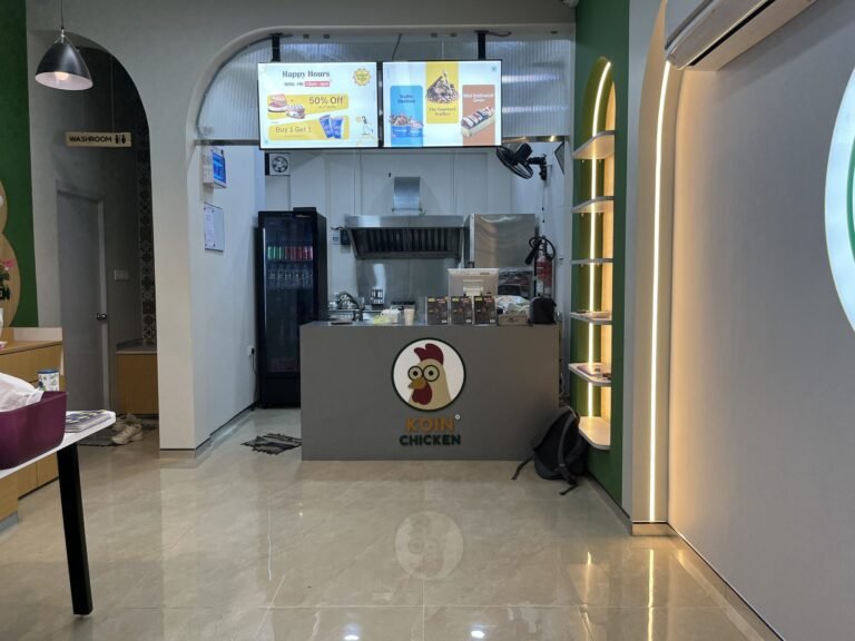 Koin Chicken acrylic logo on service counter front