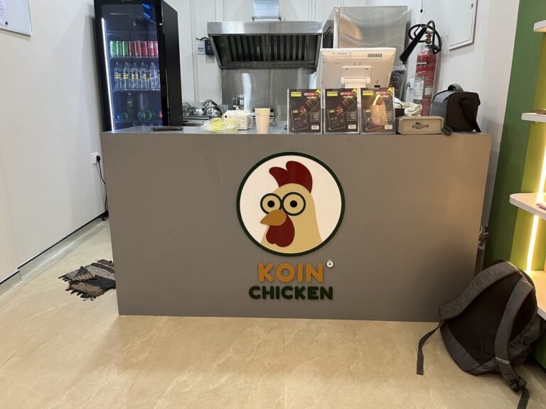 Koin Chicken acrylic counter logo panel