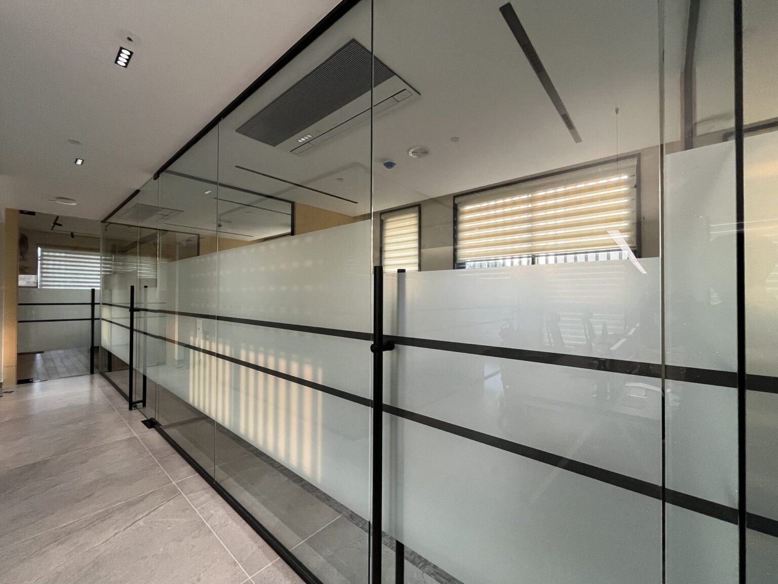 Corridor glazing with frosted film banding