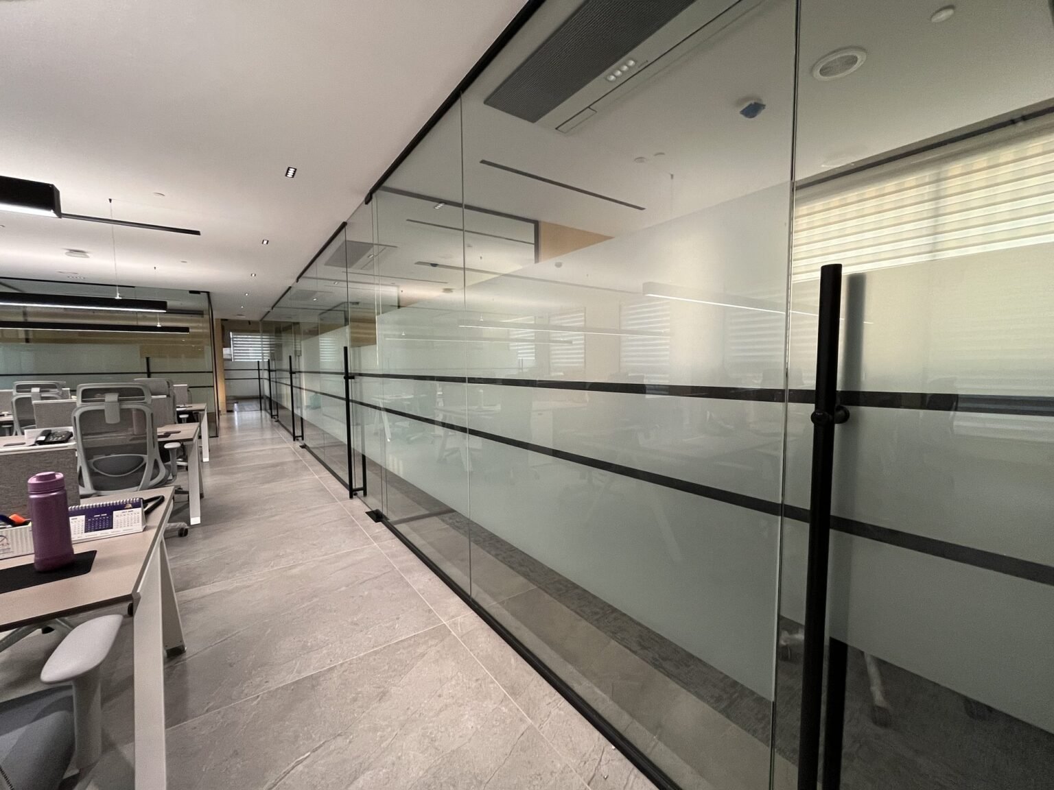 Corridor glazing with frosted film banding