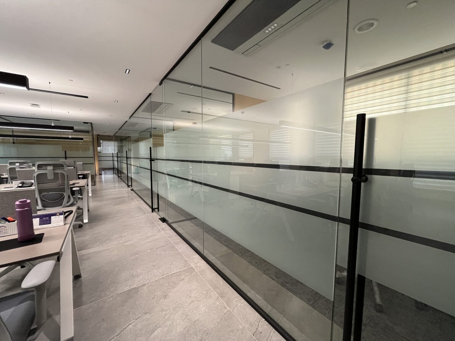 Corridor glazing with frosted film banding