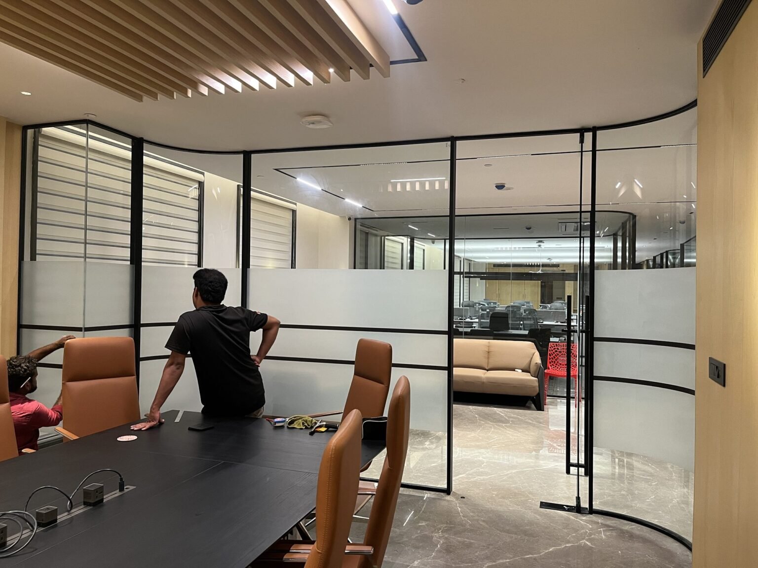 Framed glass office partition with frosted film banding