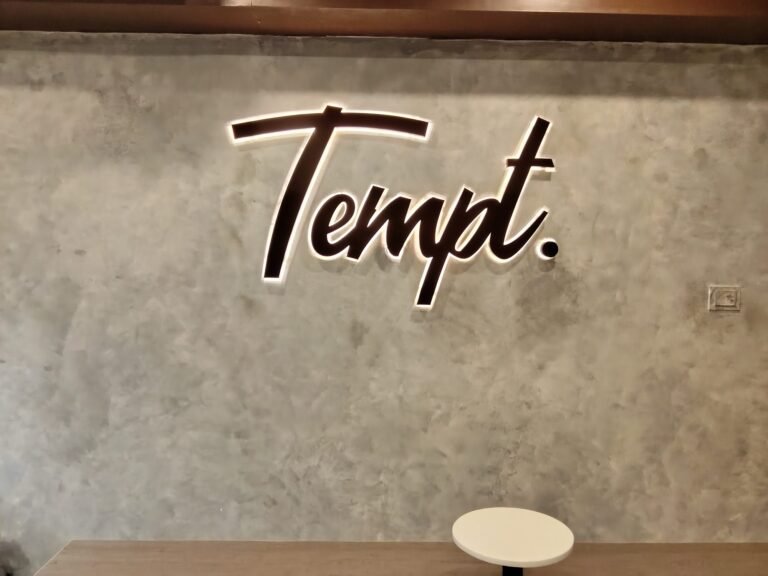 Tempt. 3D lettering on textured interior wall