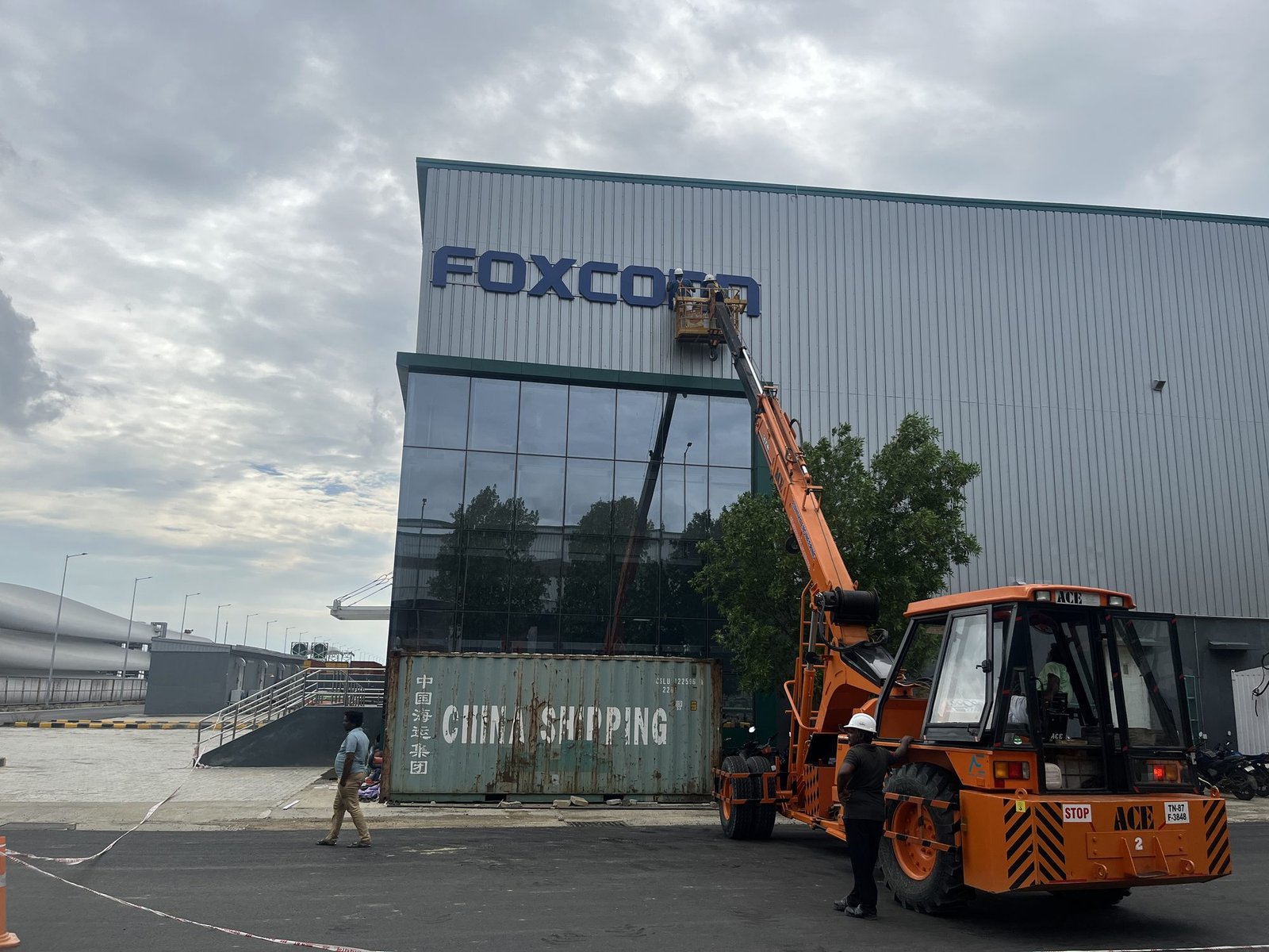 Foxconn facade letters being installed by boom lift