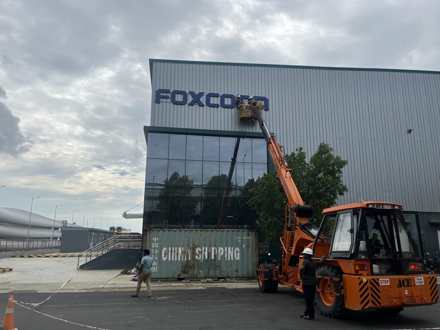 Installing Foxconn facade lettering at height by crane