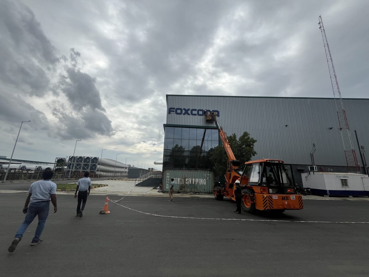 Installing Foxconn facade lettering at height by crane