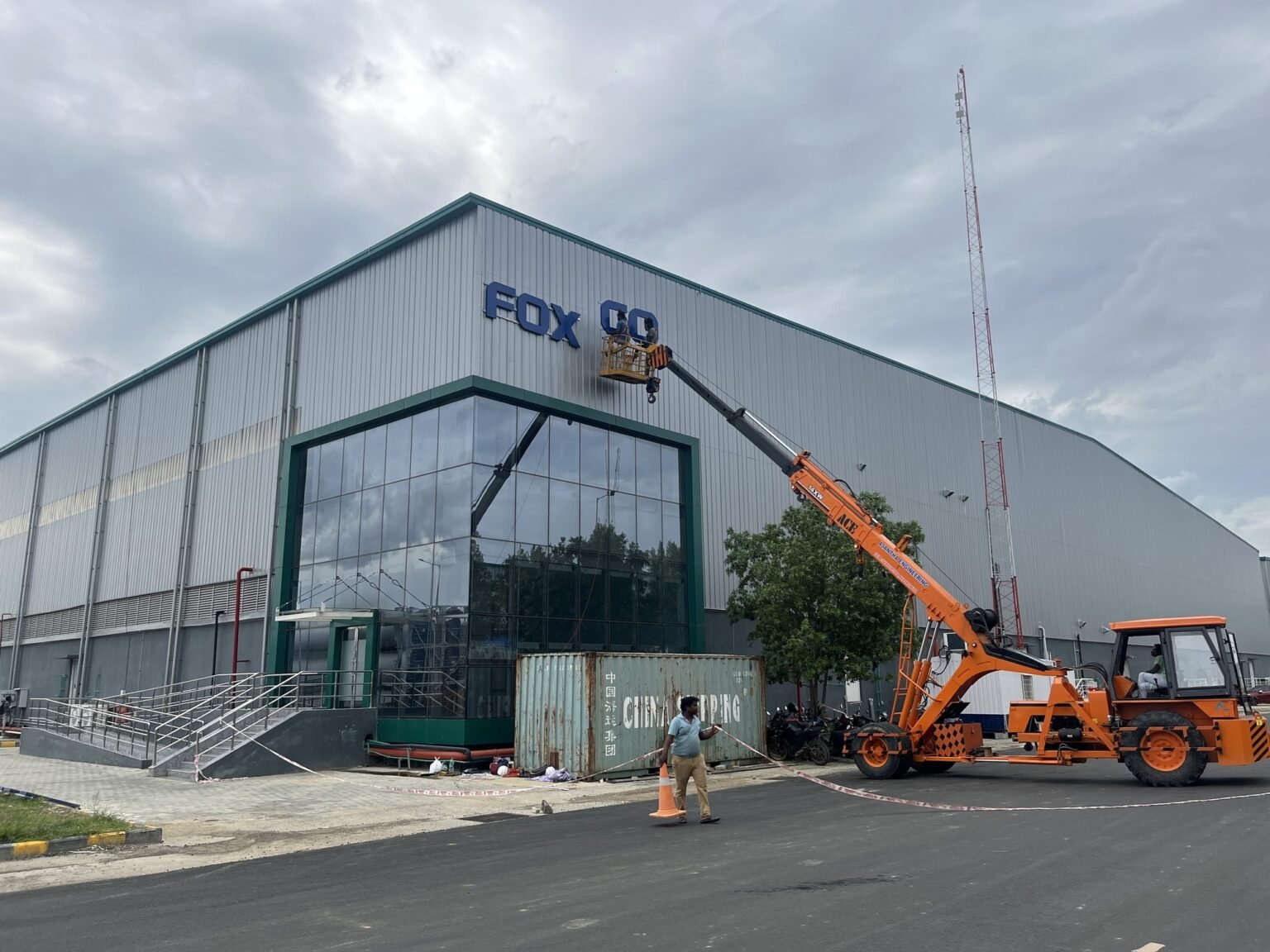 Installing Foxconn facade lettering at height by crane