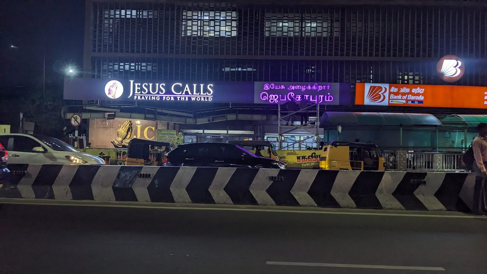 Jesus Calls LED signboard lit at night on main road