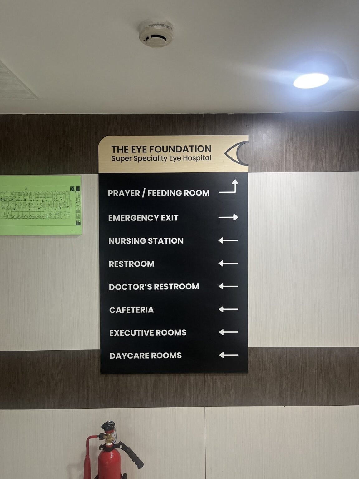 Directional wayfinding board in hospital corridor