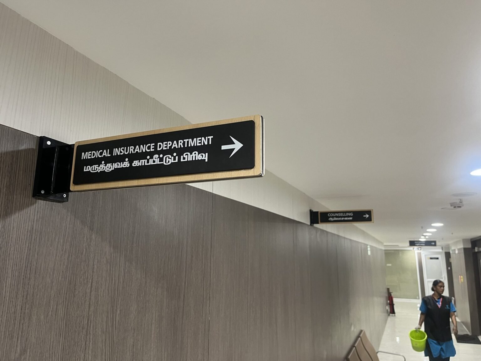 Directional wayfinding board in hospital corridor