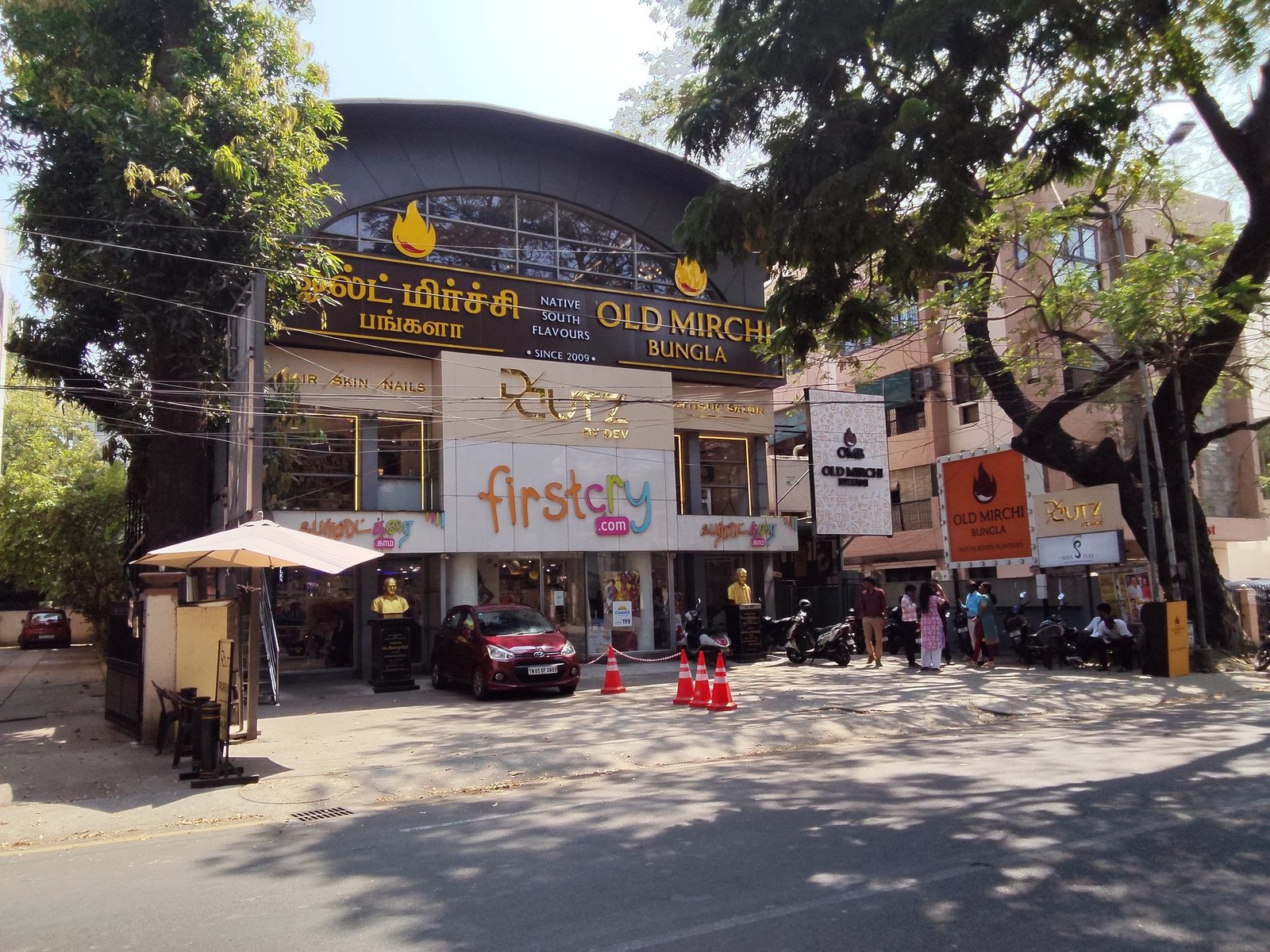 Old Mirchi and Firstcry trimcap shopfront signage